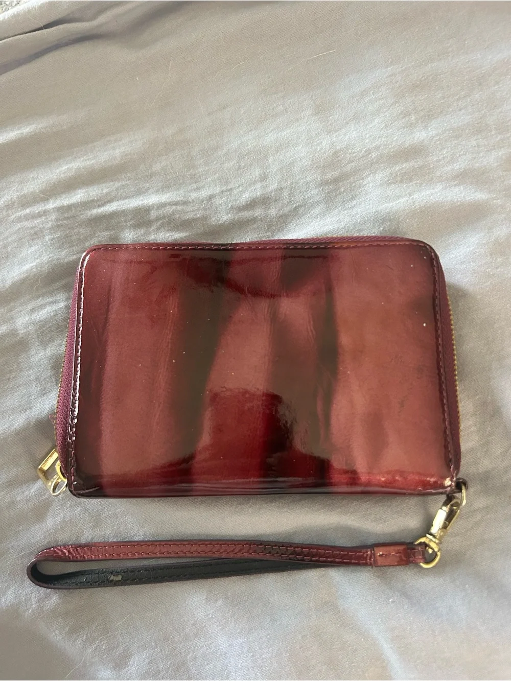 Hard to find patterned Patent Purple Wristlet Wallet with Gold Tone Hardware.